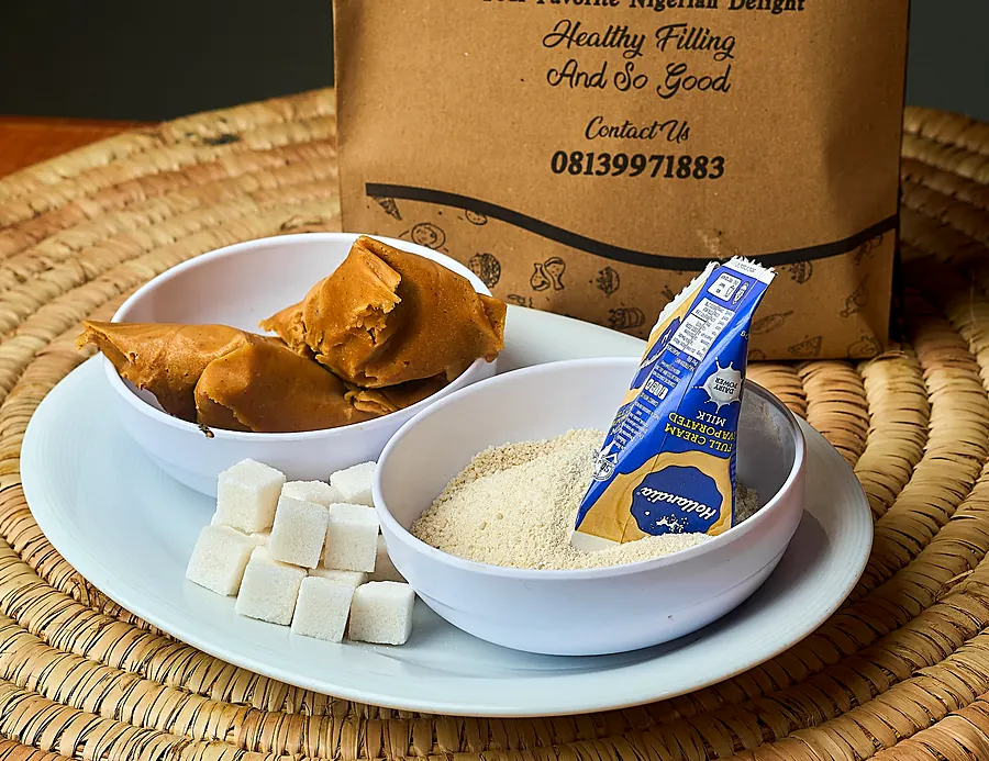 Moi moi and garri served in front of a Moi Moi Republic bag